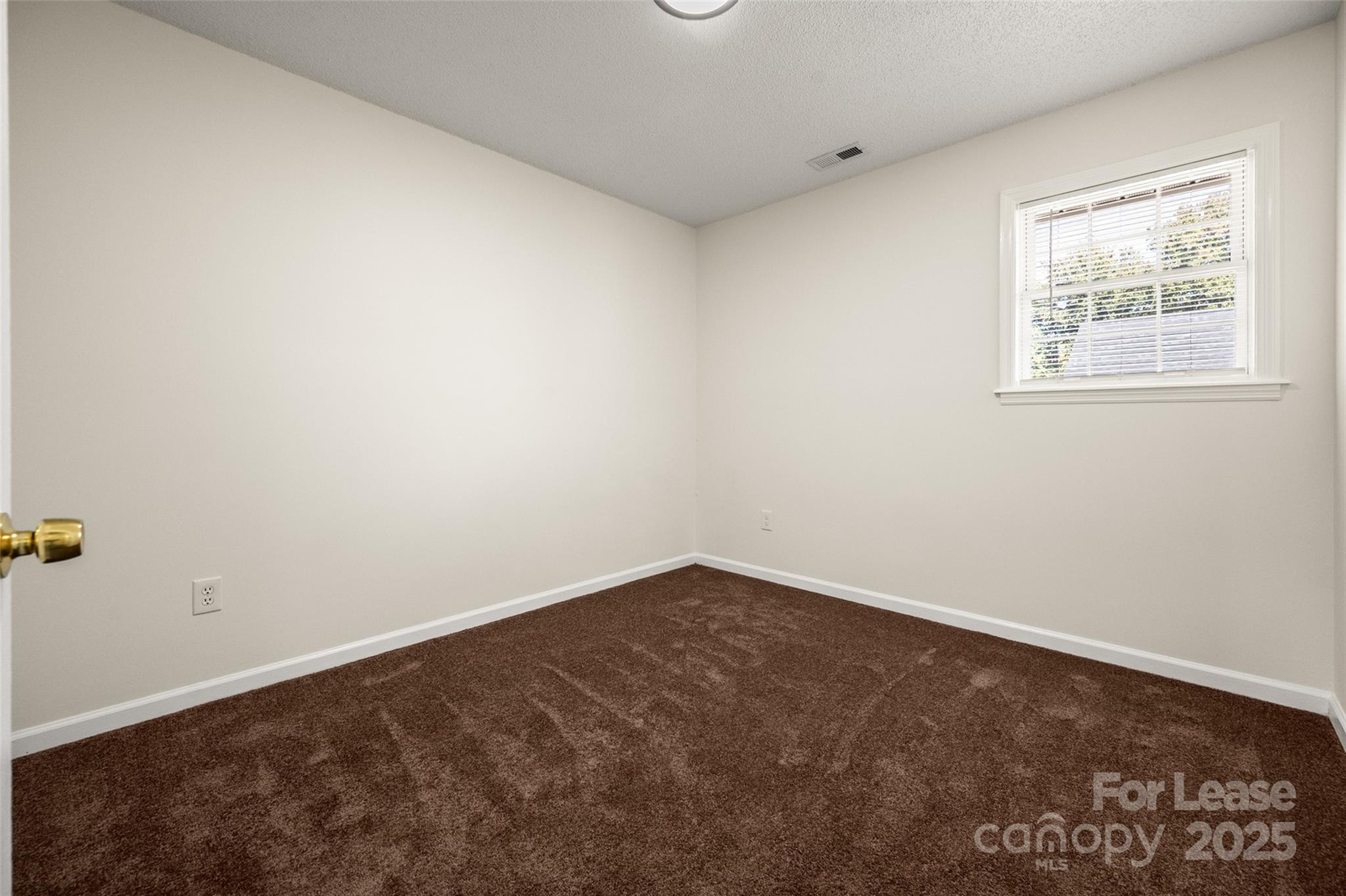 608 Bethpage Road Kannapolis, NC 28081 - Photo 27 of 37 an empty room with a window