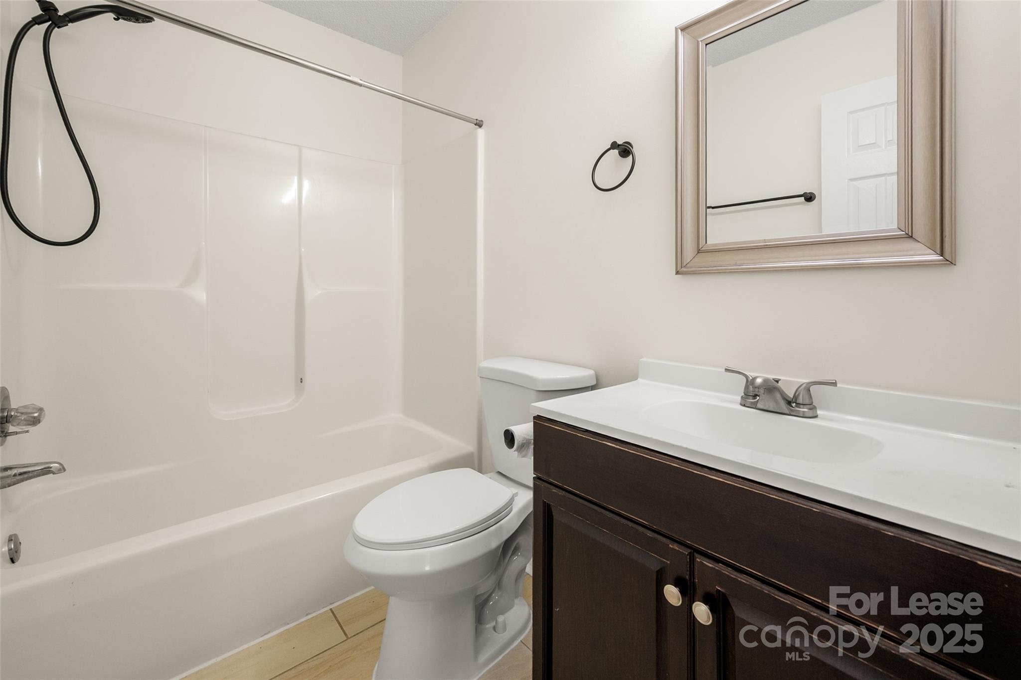 608 Bethpage Road Kannapolis, NC 28081 - Photo 31 of 37 a bathroom with a sink a toilet and shower