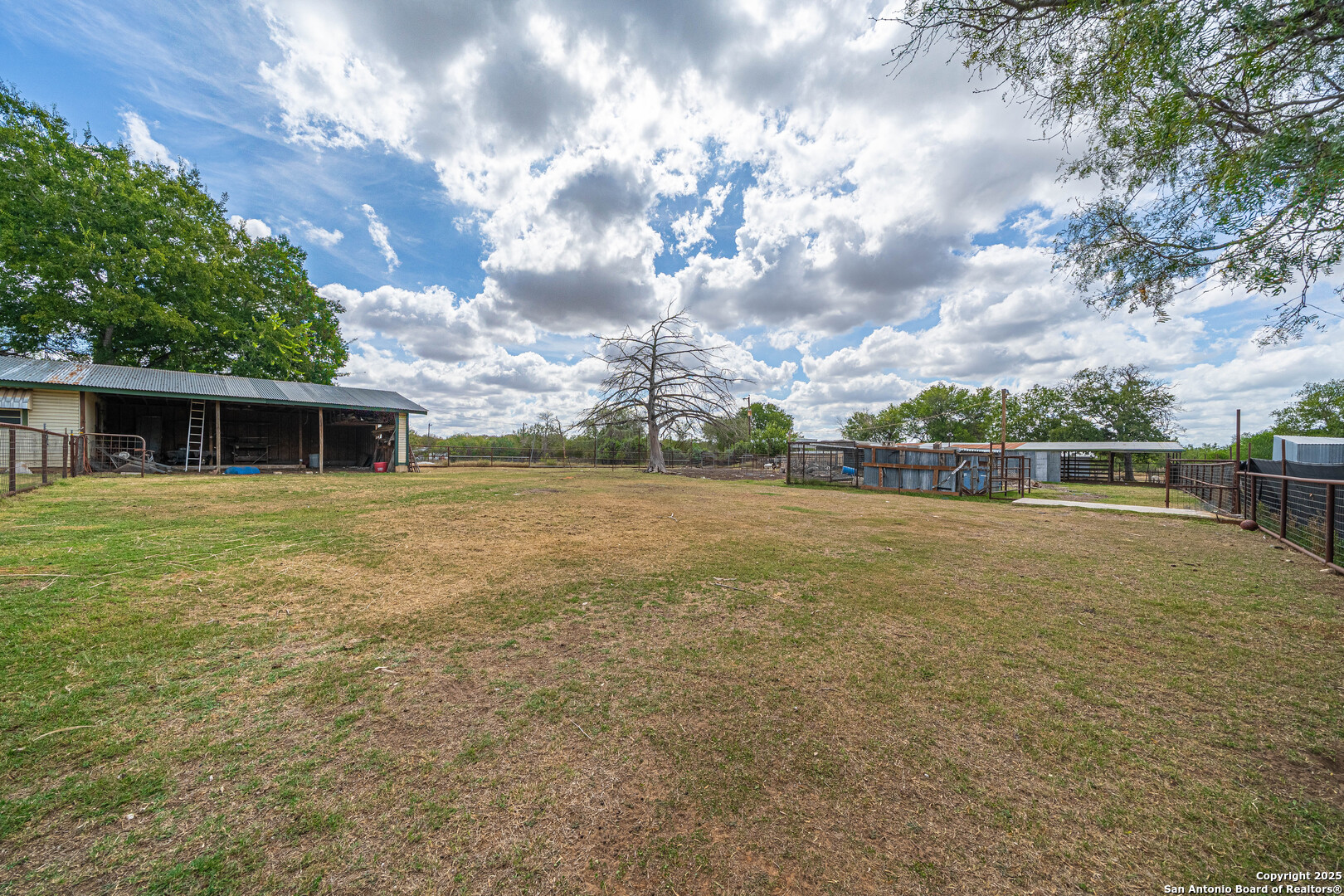 10544 Macaway Road Adkins, TX 78101 - Photo 12 of 40 a view of a house with a yard
