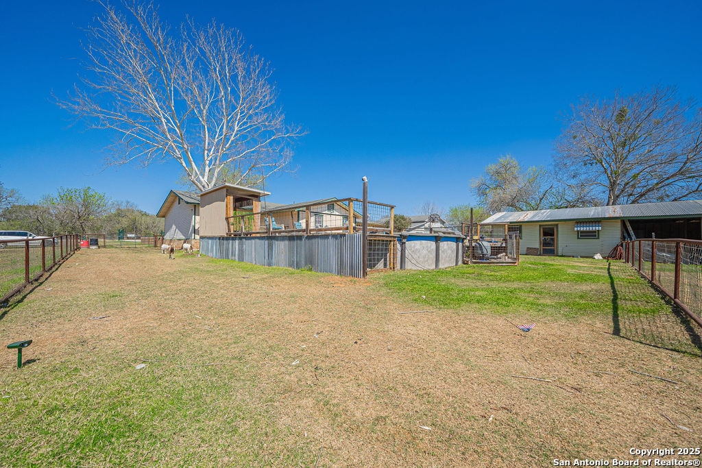 10544 Macaway Road Adkins, TX 78101 - Photo 17 of 40 a view of backyard of house with green space