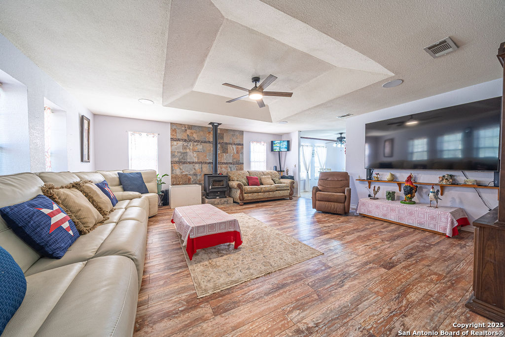 10544 Macaway Road Adkins, TX 78101 - Photo 30 of 40 a living room with furniture and a flat screen tv