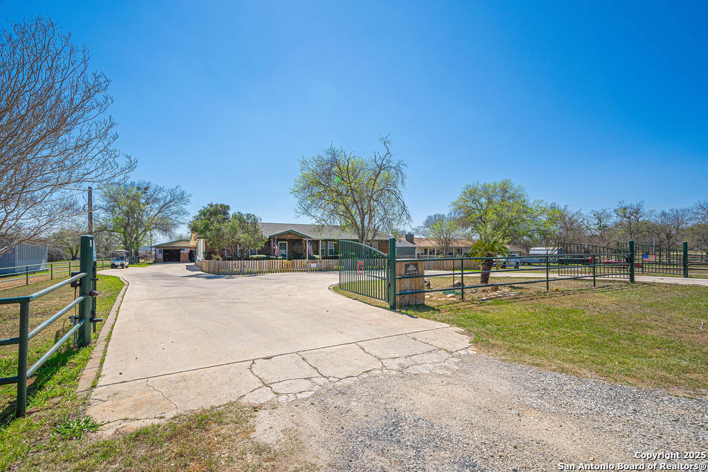 10544 Macaway Road Adkins, TX 78101 - Photo 3 of 40 a view of a swimming pool with an outdoor space and seating area