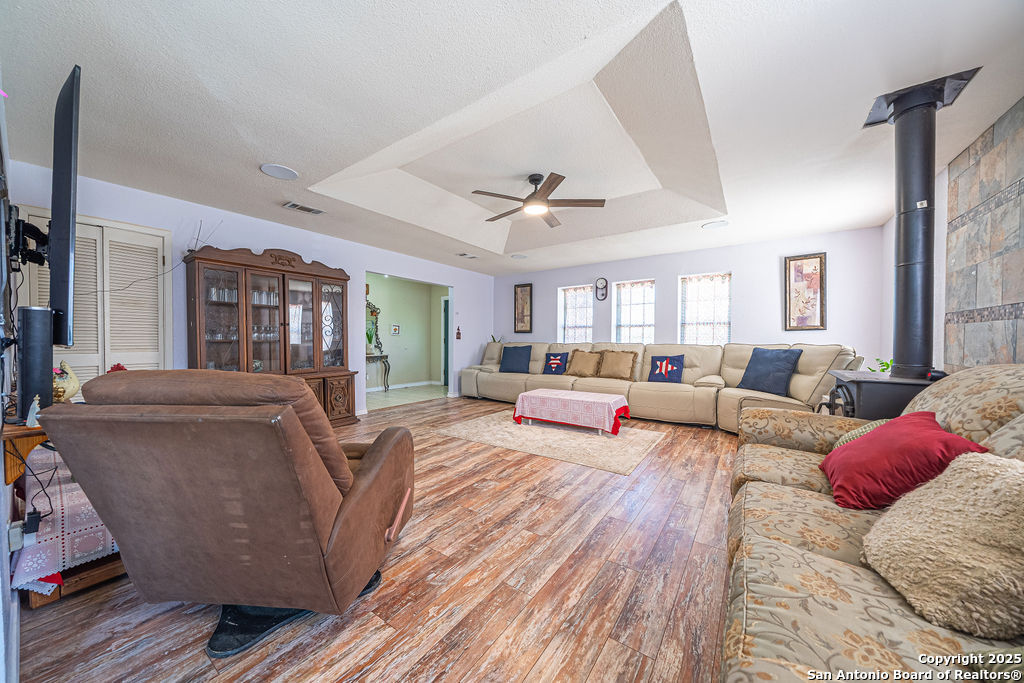 10544 Macaway Road Adkins, TX 78101 - Photo 31 of 40 a living room with furniture and a ceiling fan