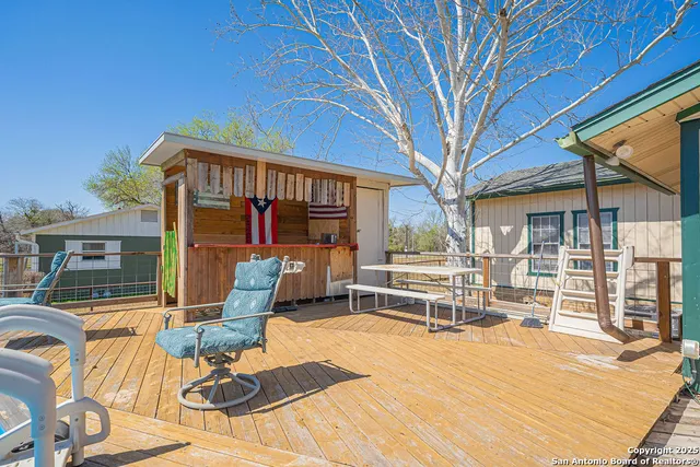 a view of a swimming pool with an outdoor seating