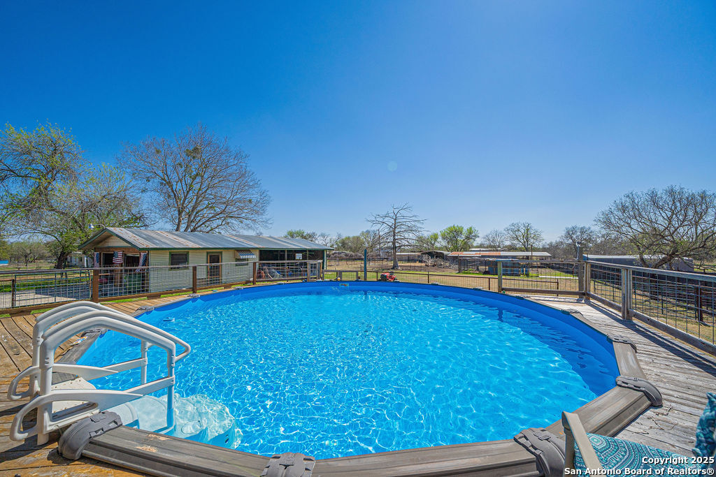 10544 Macaway Road Adkins, TX 78101 - Photo 8 of 40 a view of a swimming pool with an outdoor seating
