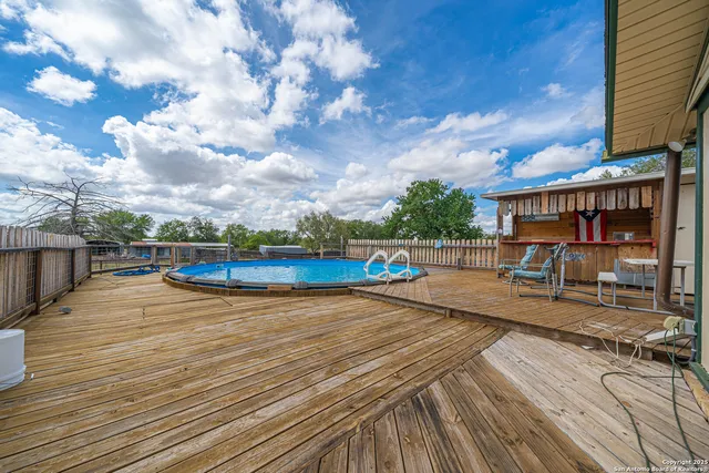 an aerial view of a house having swimming pool