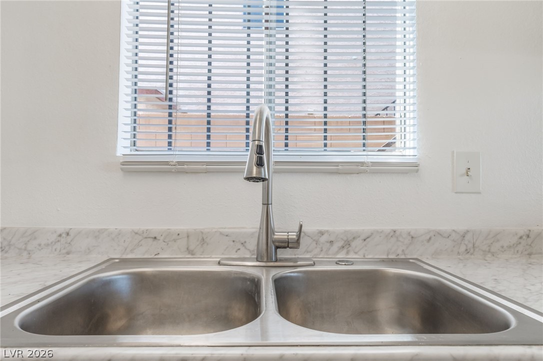 2257 Exeter Drive, Unit B Las Vegas, NV 89156 - Photo 21 of 39 Kitchen view of light stone countertops