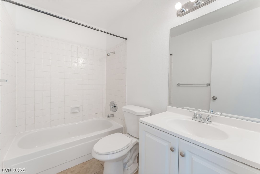 2257 Exeter Drive, Unit B Las Vegas, NV 89156 - Photo 24 of 39 Bathroom with shower / bath combination, vanity, and light tile patterned floors