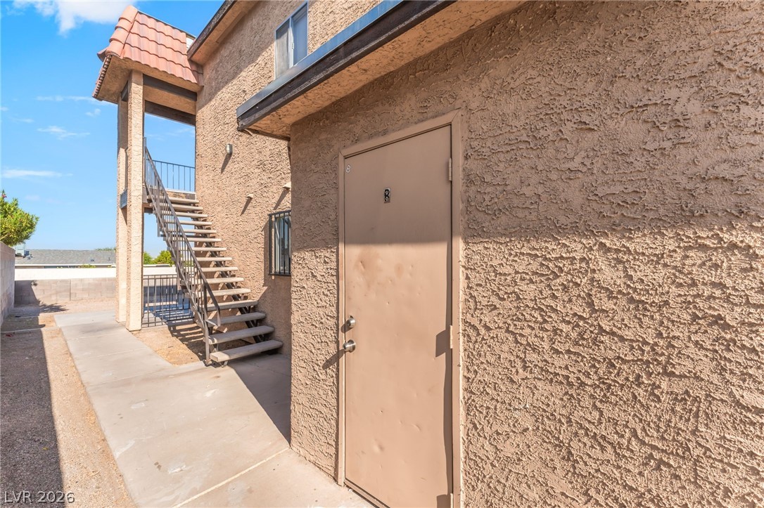 2257 Exeter Drive, Unit B Las Vegas, NV 89156 - Photo 35 of 39 Property entrance featuring stucco siding