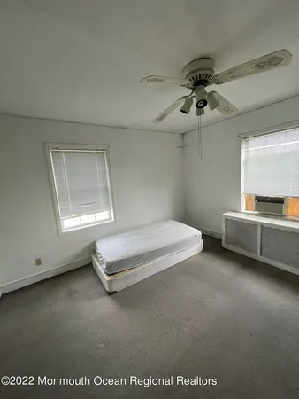 a view of a bedroom with cabinet