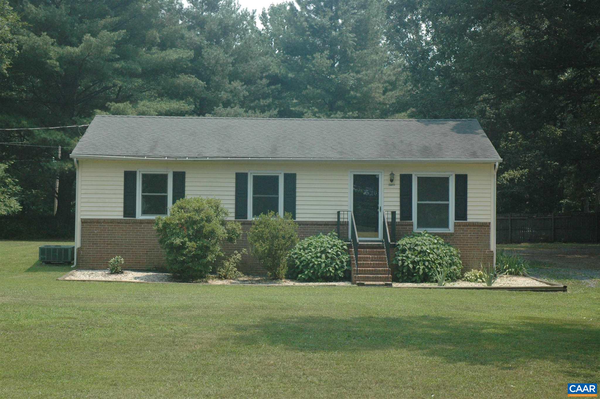 3396 Cedar Lane Road Kents Store, VA 23084 - Photo 1 of 50 a front view of house with yard and green space