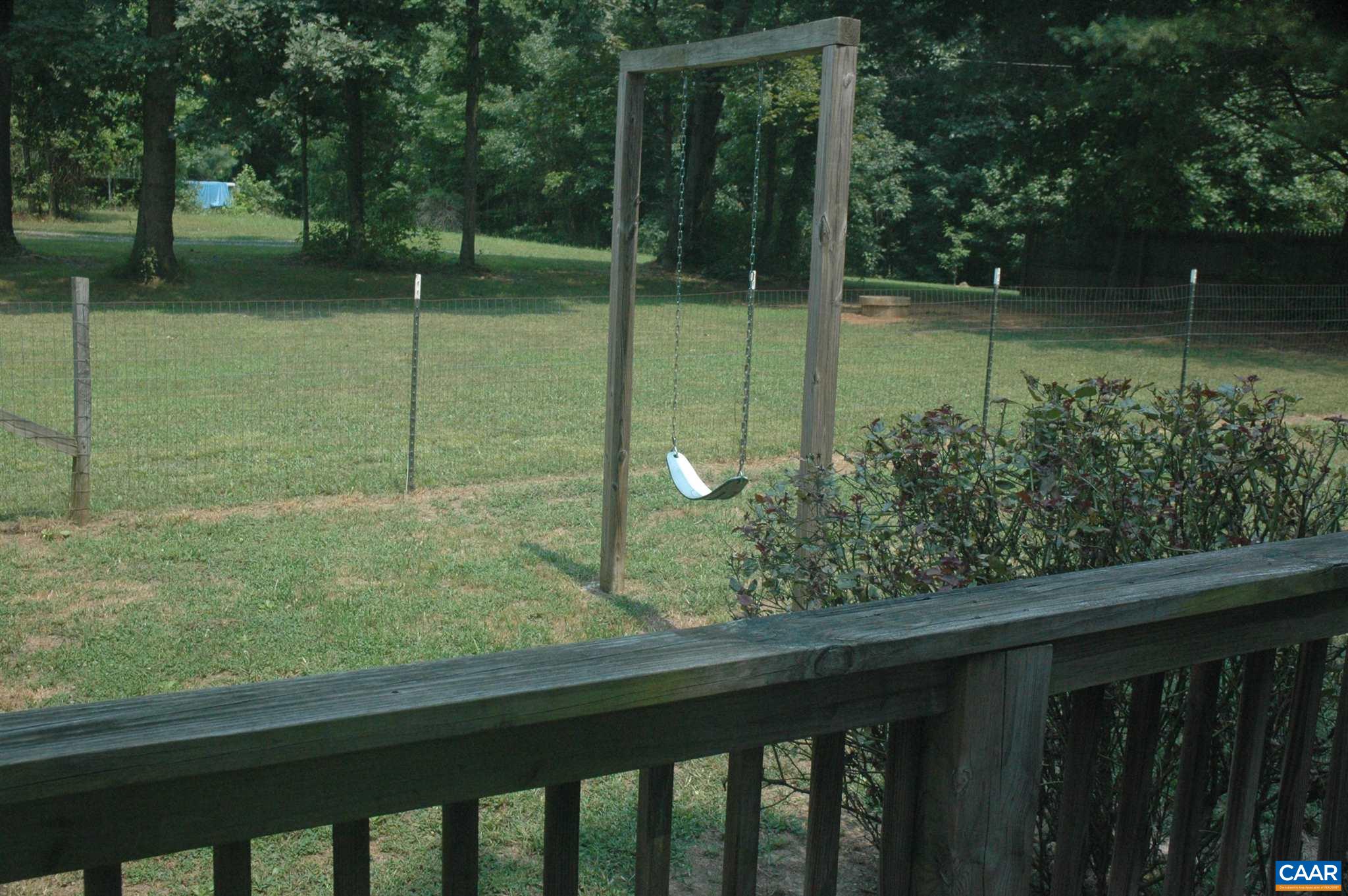 3396 Cedar Lane Road Kents Store, VA 23084 - Photo 11 of 50 a view of a wooden deck and a yard