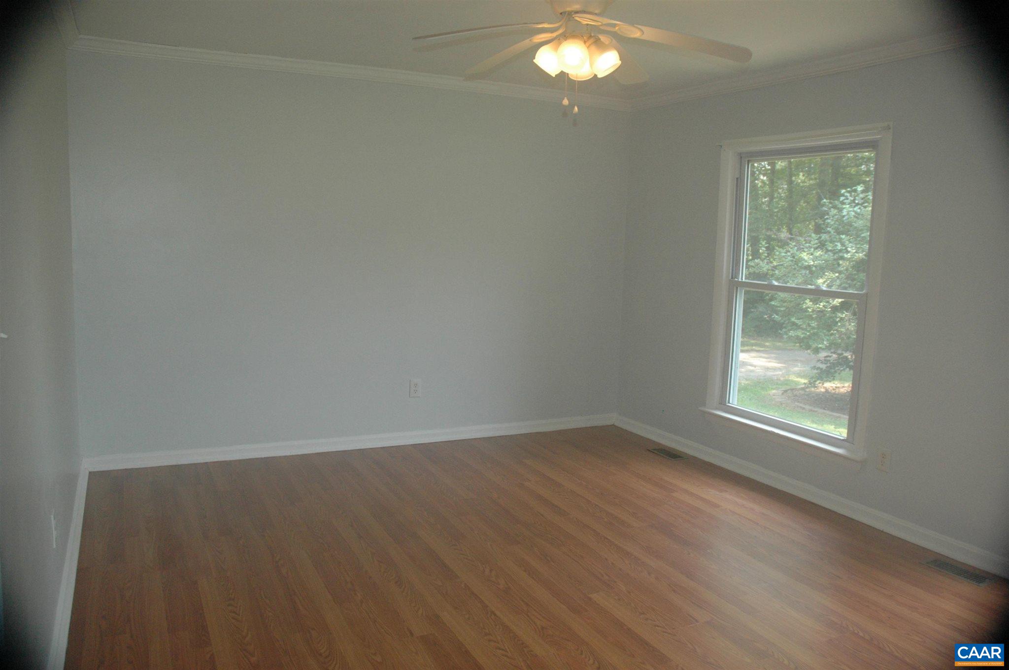3396 Cedar Lane Road Kents Store, VA 23084 - Photo 16 of 50 an empty room with wooden floor and windows