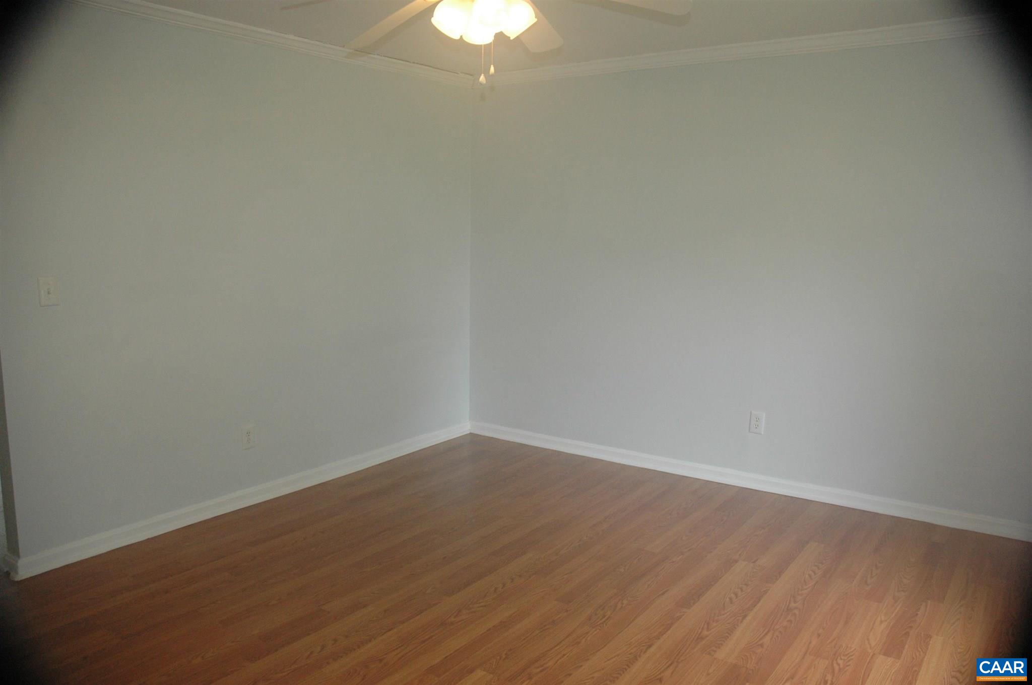 3396 Cedar Lane Road Kents Store, VA 23084 - Photo 18 of 50 a view of an empty room with wooden floor and a window