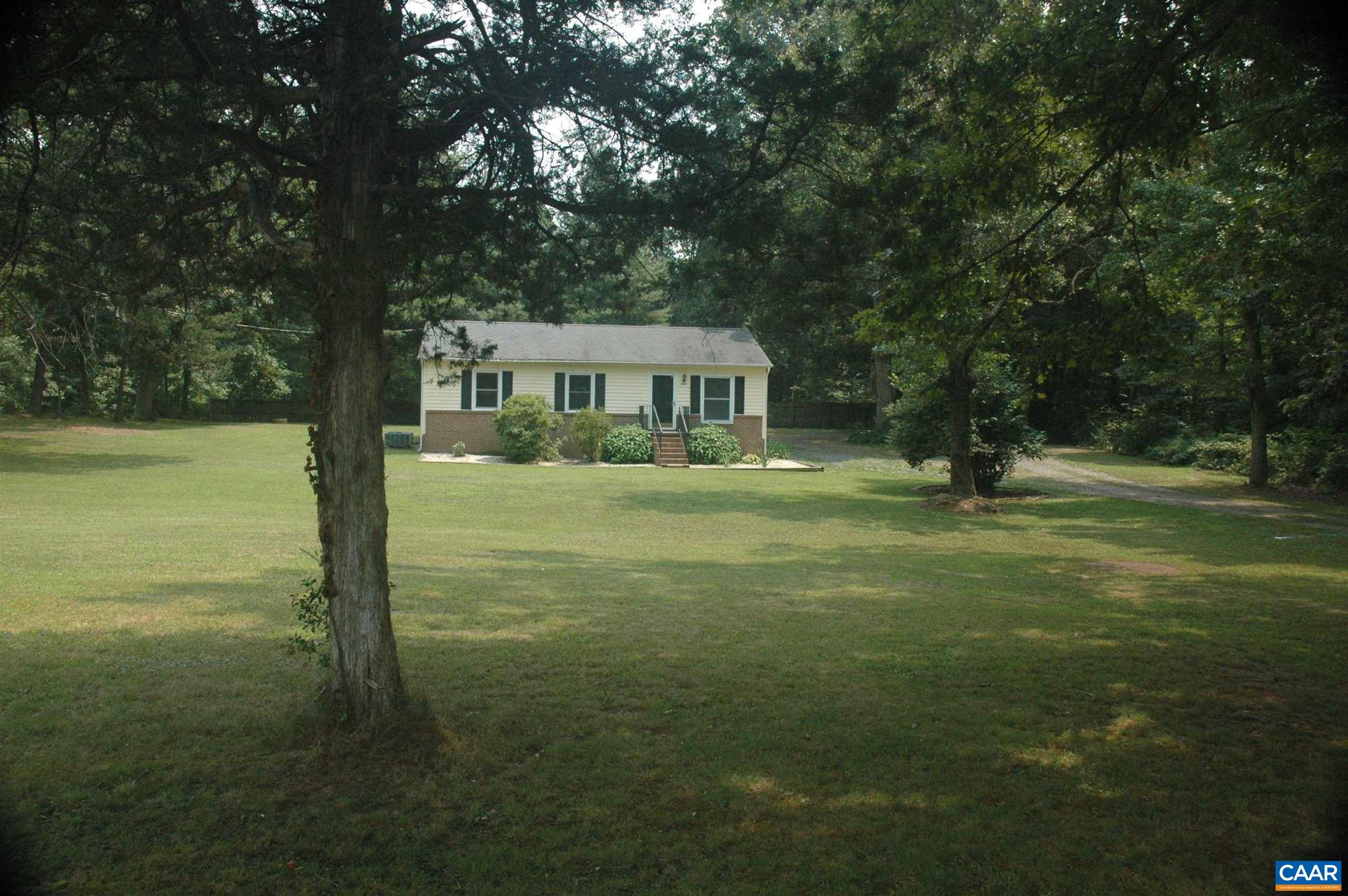 3396 Cedar Lane Road Kents Store, VA 23084 - Photo 2 of 50 a front view of a house with a yard