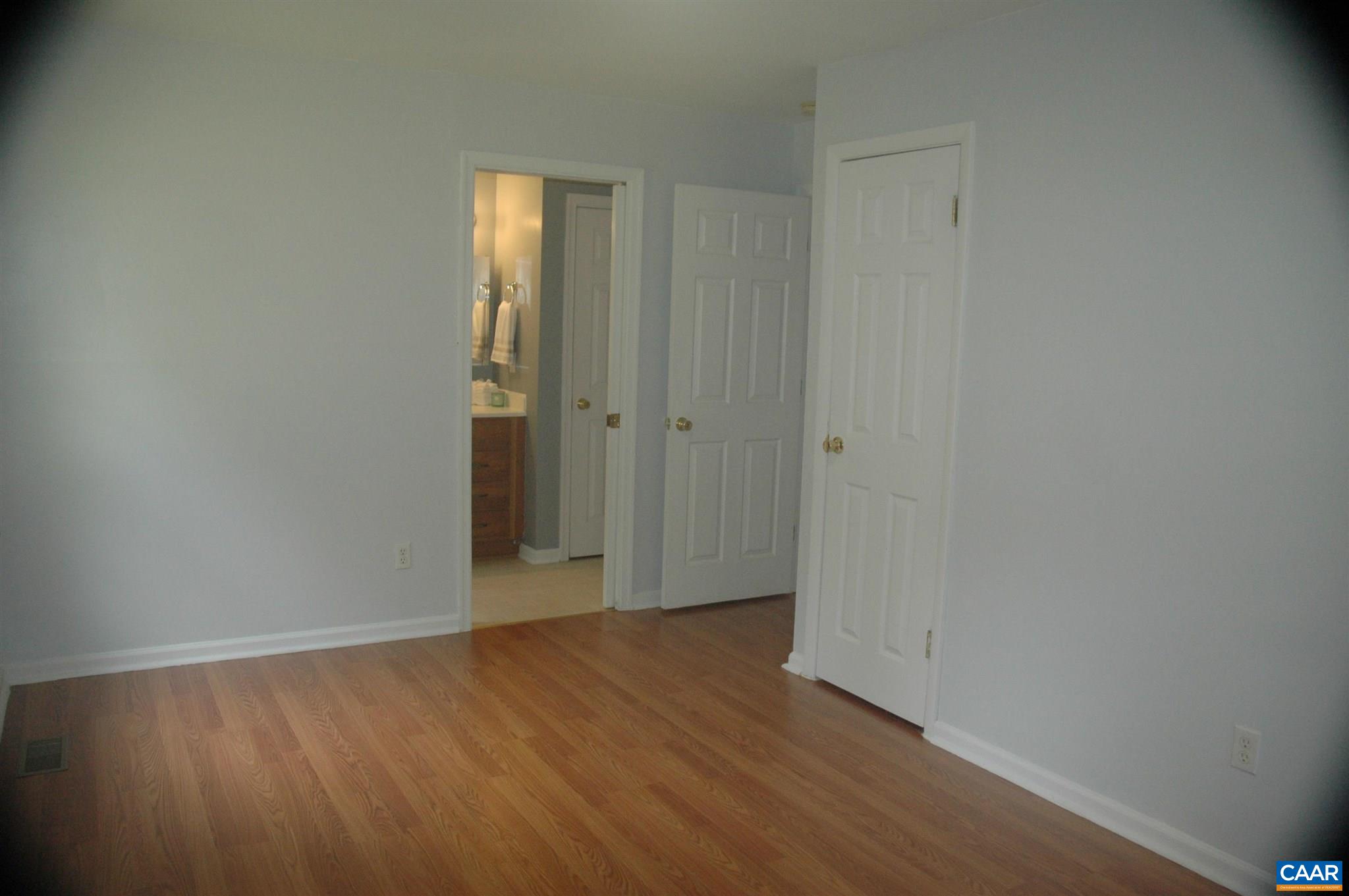 3396 Cedar Lane Road Kents Store, VA 23084 - Photo 32 of 50 a view of an empty room with wooden floor and closet