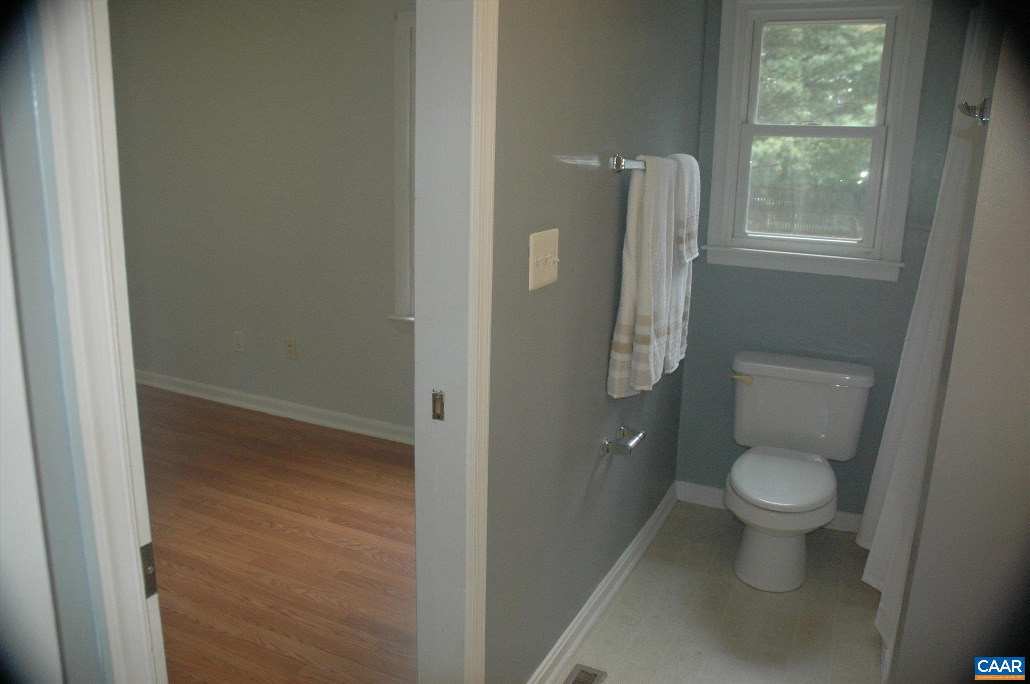 3396 Cedar Lane Road Kents Store, VA 23084 - Photo 33 of 50 a bathroom with a toilet and a sink