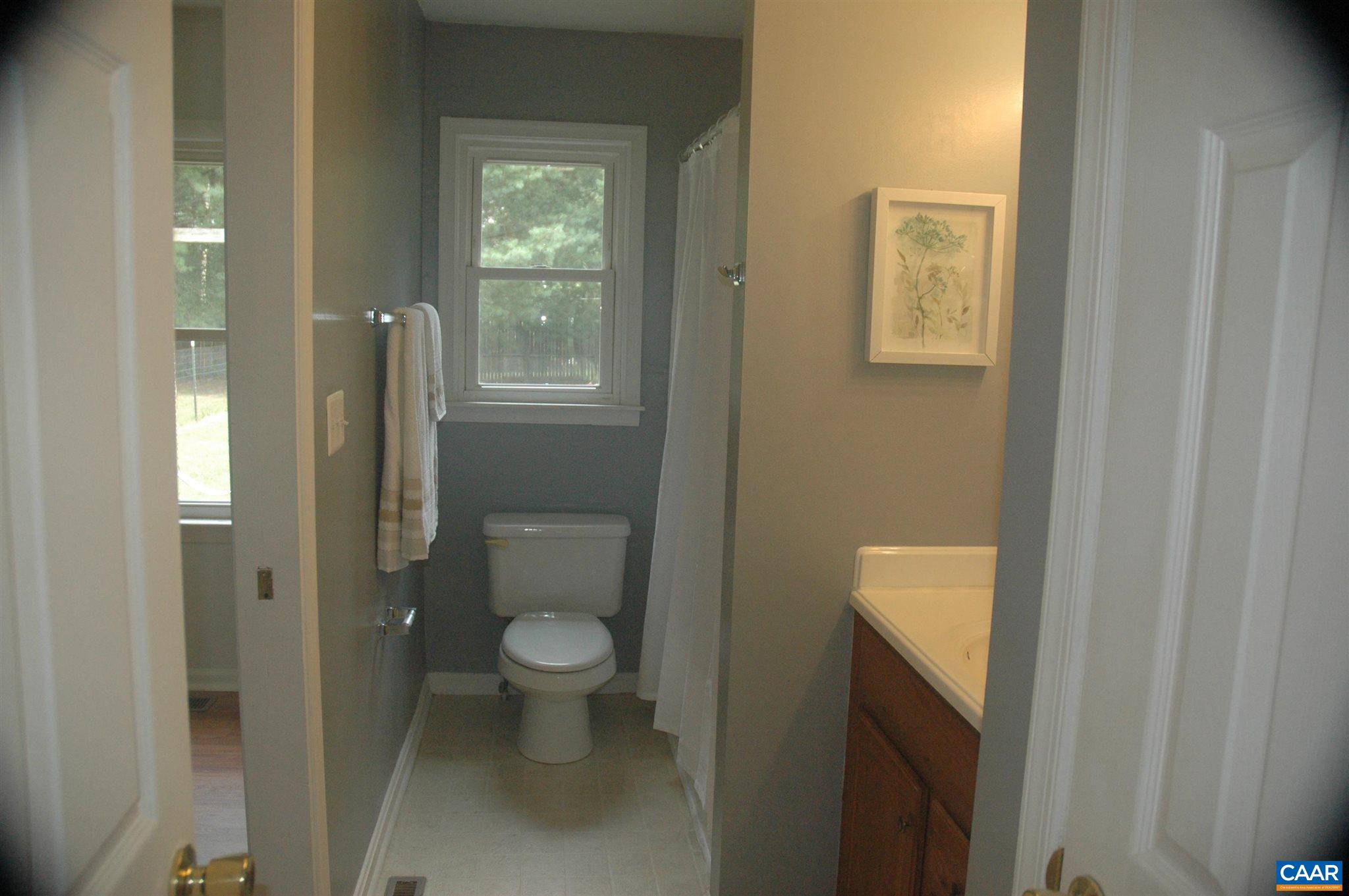 3396 Cedar Lane Road Kents Store, VA 23084 - Photo 34 of 50 a bathroom with a toilet and a shower