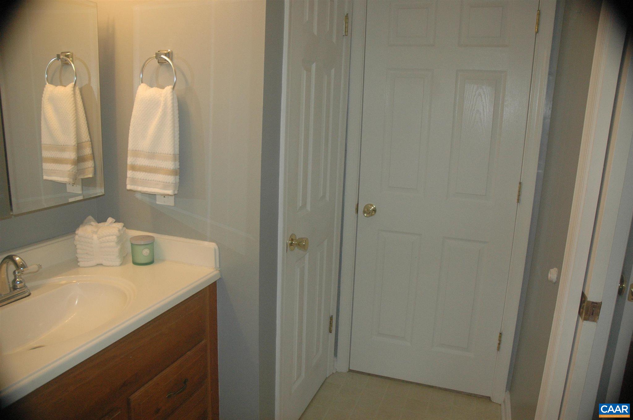 3396 Cedar Lane Road Kents Store, VA 23084 - Photo 38 of 50 a bathroom with a sink vanity and a mirror