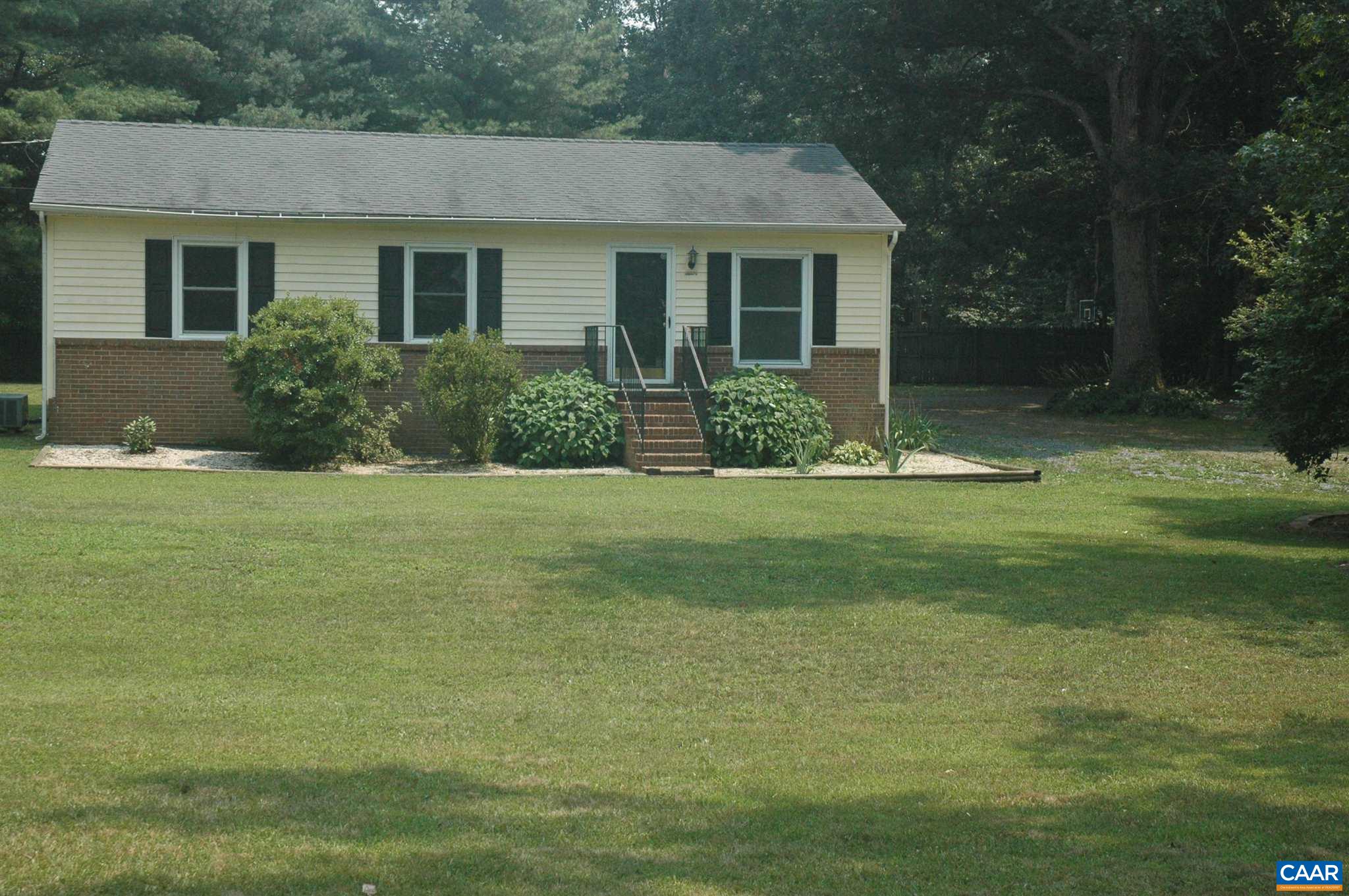 3396 Cedar Lane Road Kents Store, VA 23084 - Photo 4 of 50 a front view of house with yard and green space
