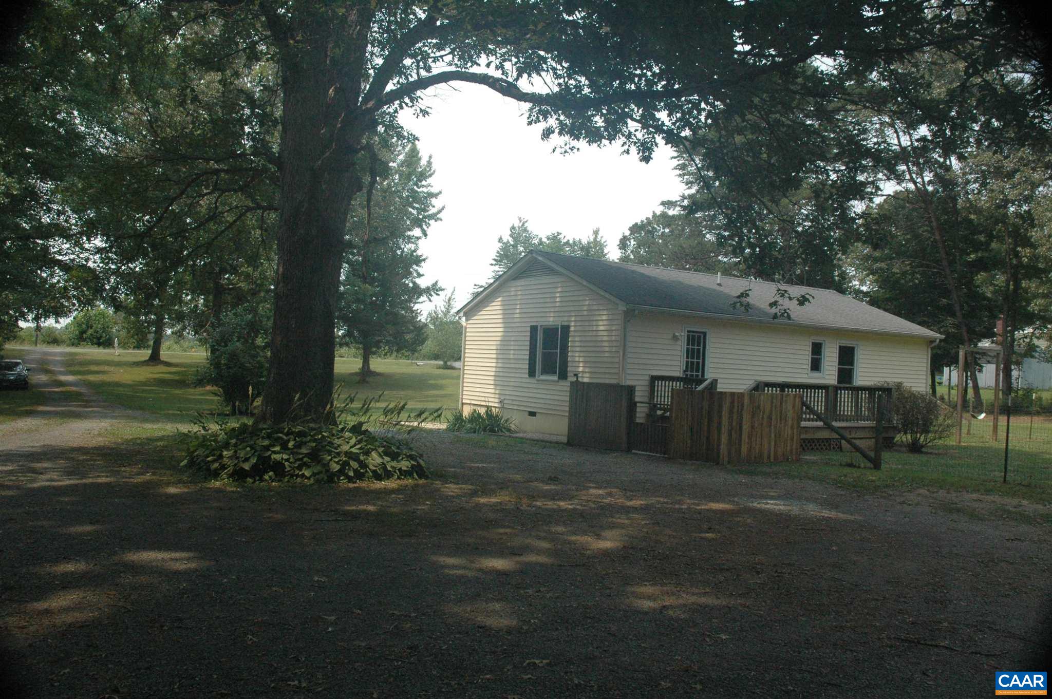 3396 Cedar Lane Road Kents Store, VA 23084 - Photo 7 of 50 a view of a house with a garden