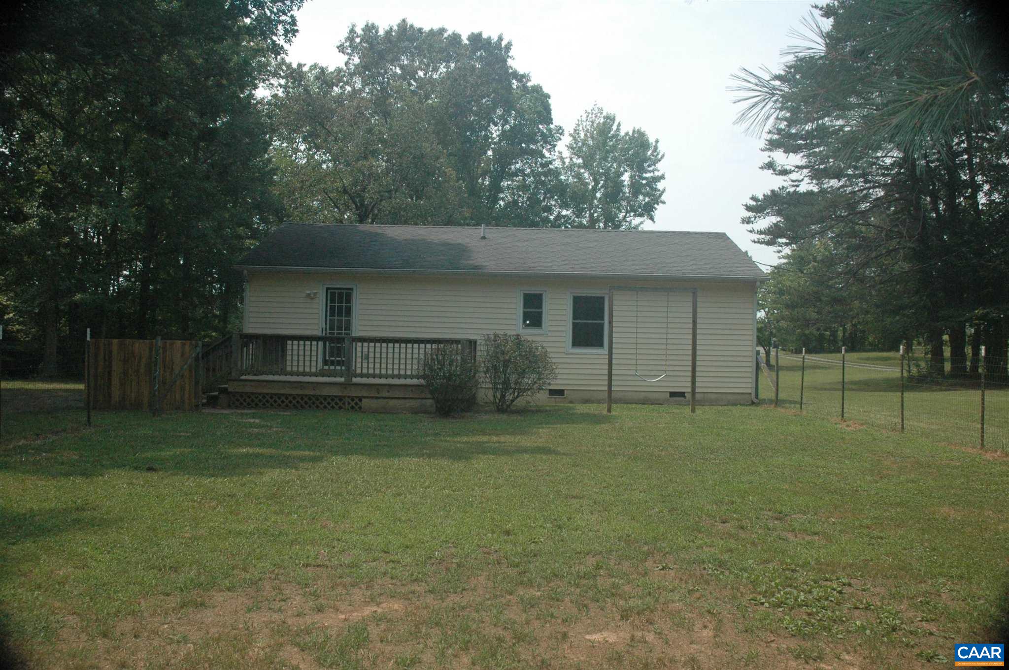 3396 Cedar Lane Road Kents Store, VA 23084 - Photo 9 of 50 a front view of house with yard and trees in the background