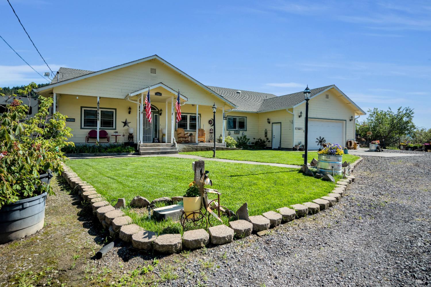 3970 Canyon Road Willits, CA 95490 - Photo 43 of 73 a front view of a house with a yard table and chairs