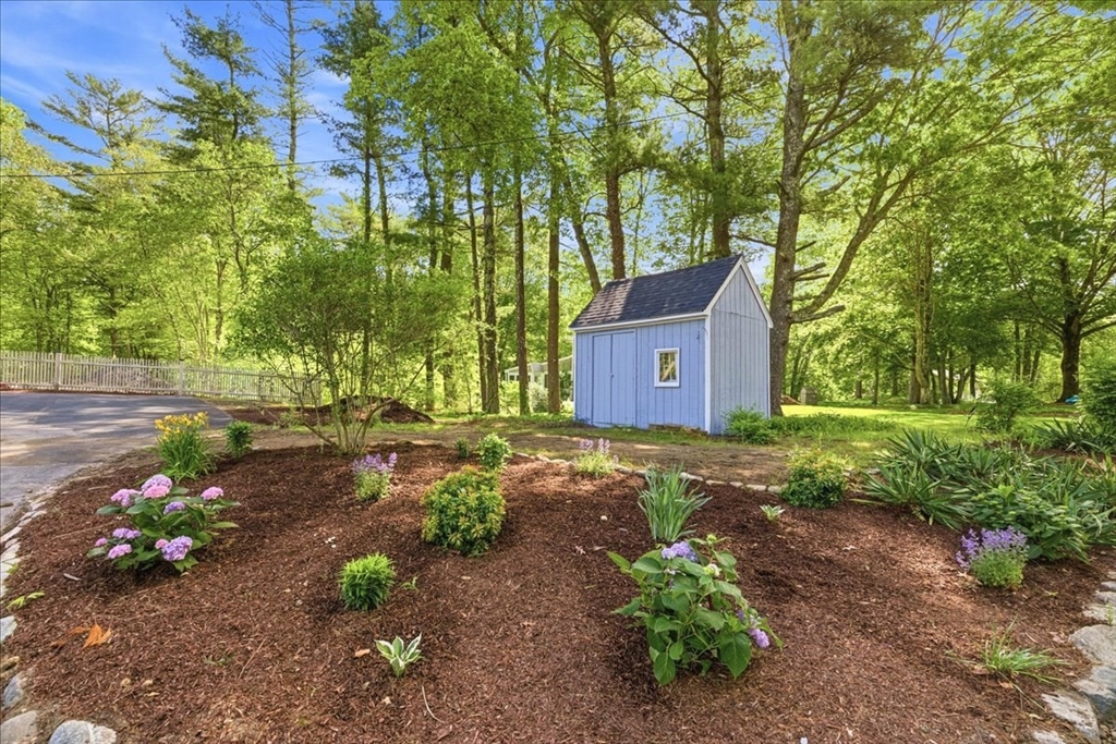 16 Churchill Road Plympton, MA 02367 - Photo 41 of 42 a fire hydrant in the middle of a yard