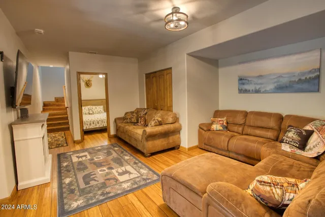 a kitchen with furniture a refrigerator and a table