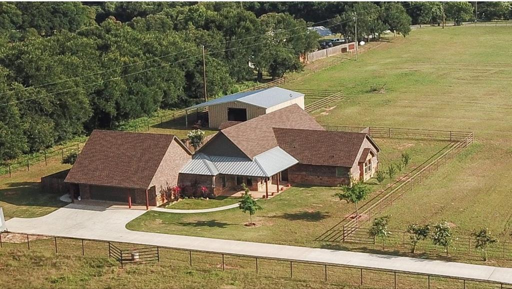 a aerial view of a house with a yard