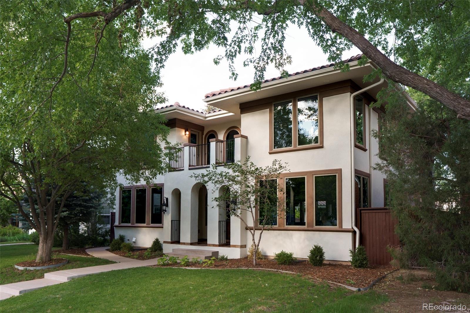 1026 South Cook Street Denver, CO 80209 - Photo 2 of 34 front view of house with a yard