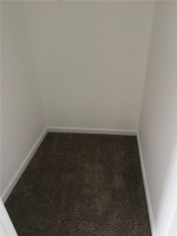 5739 Windfall Lane Lithonia, GA 30058 - Photo 21 of 36 an empty room with a bench