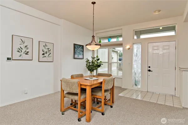 a dining room with furniture and window