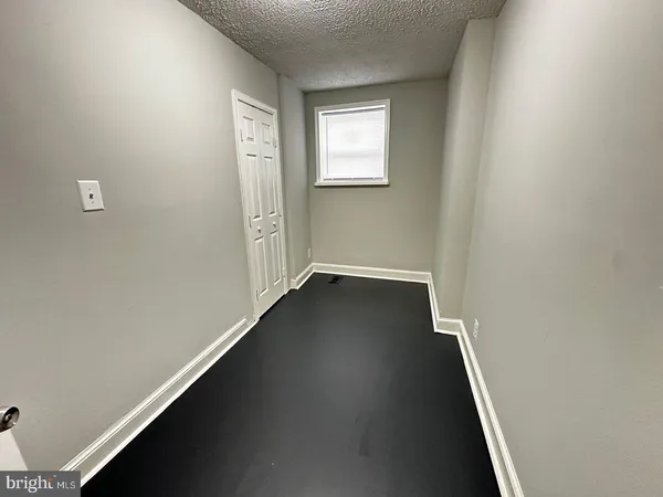 an entryway of a house with wooden floor
