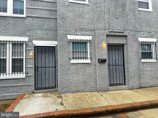 a view of entrance of the house with a window