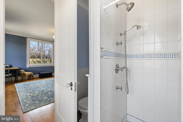 a living room with furniture rug and a table