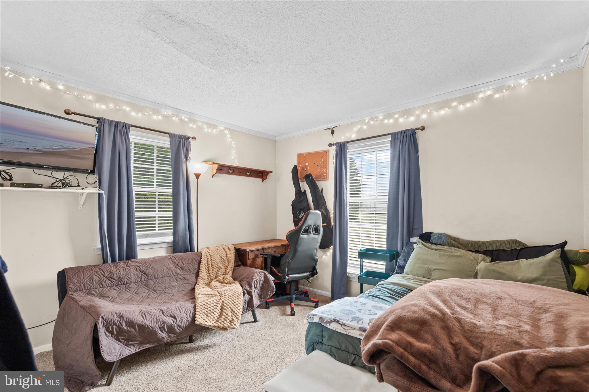 12647 Old Stage Road Bishopville, MD 21813 - Photo 30 of 84 a spacious bedroom with a bed and glass window
