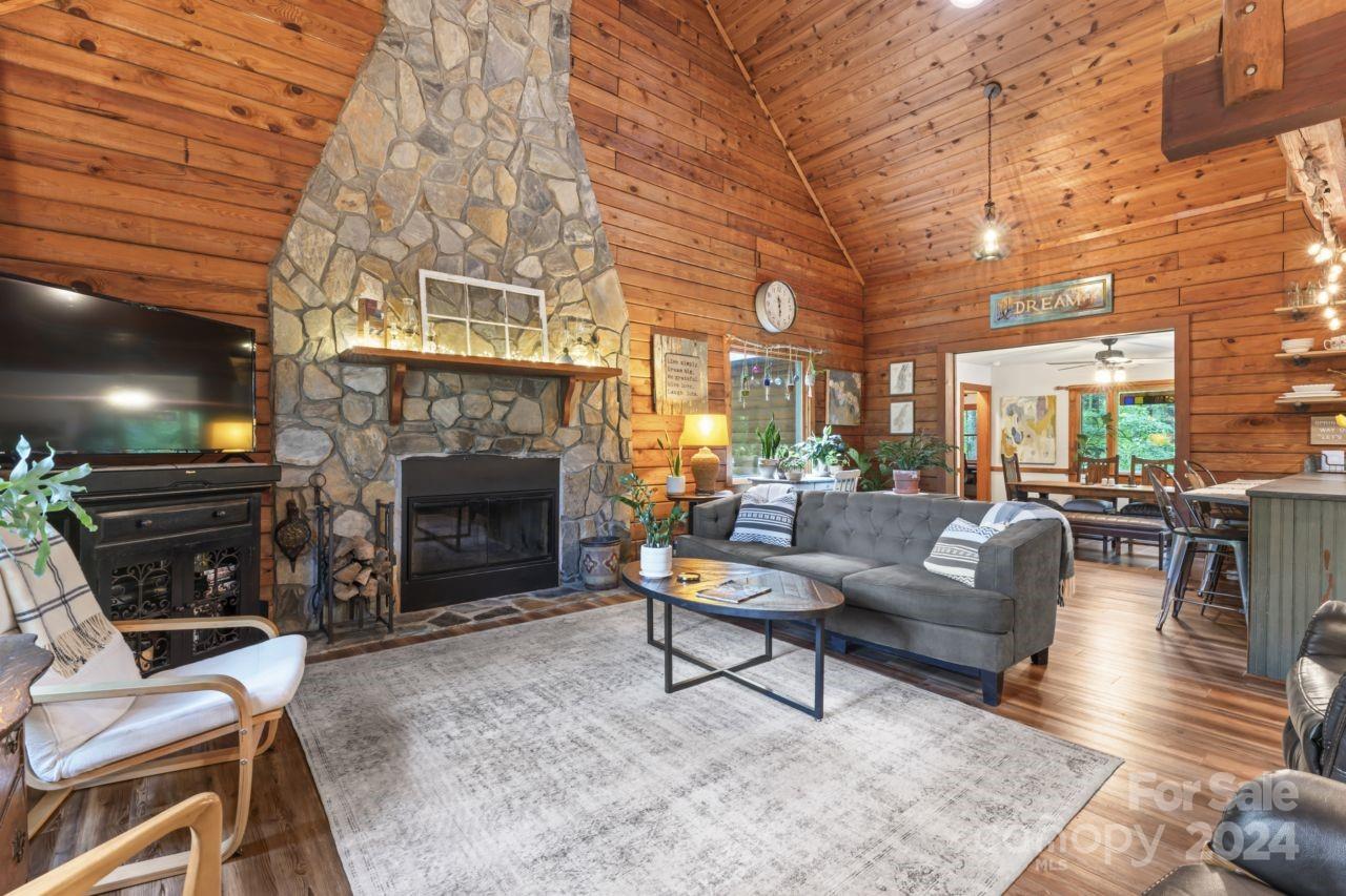 2440 Sloop Road Mount Ulla, NC 28125 - Photo 13 of 48 a living room with furniture a fireplace and a flat screen tv