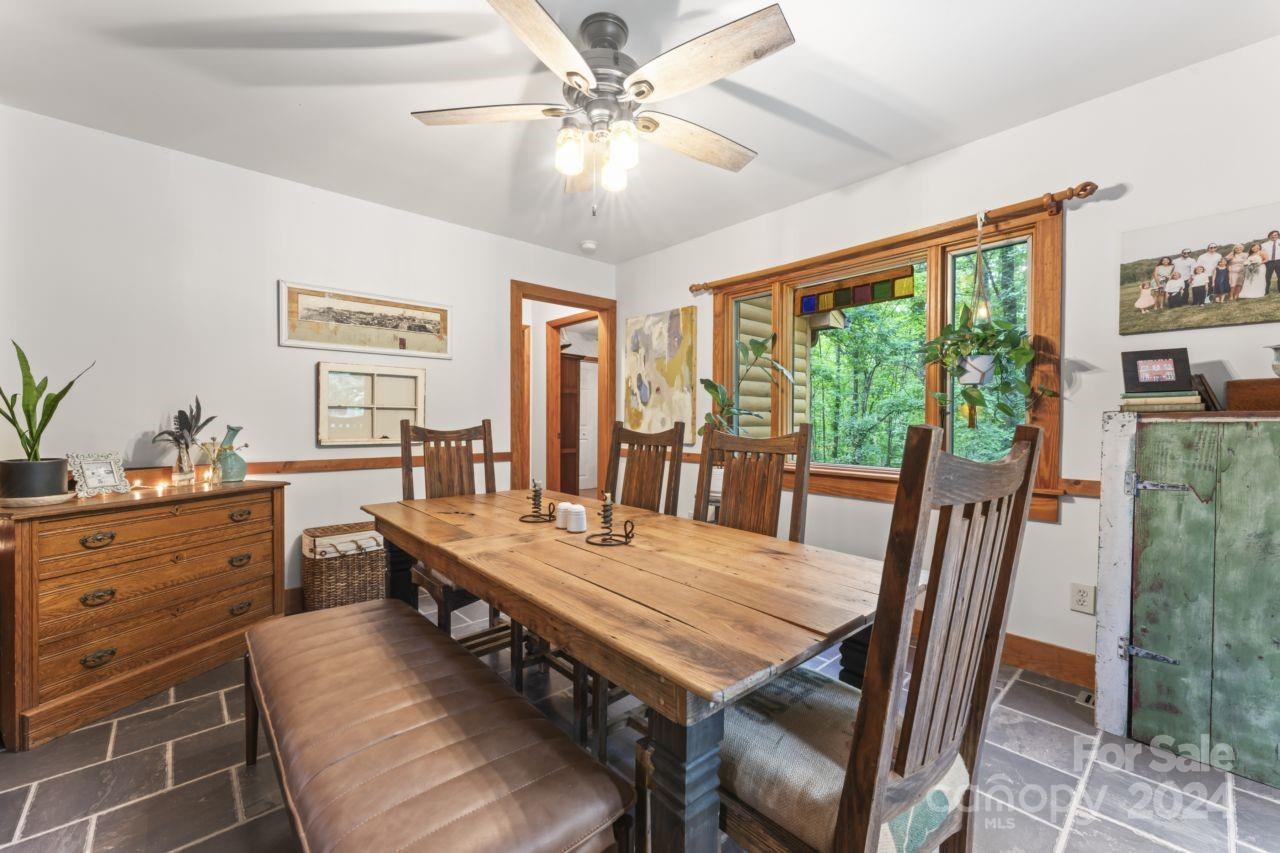 2440 Sloop Road Mount Ulla, NC 28125 - Photo 15 of 48 a view of a dining room with furniture window and outside view