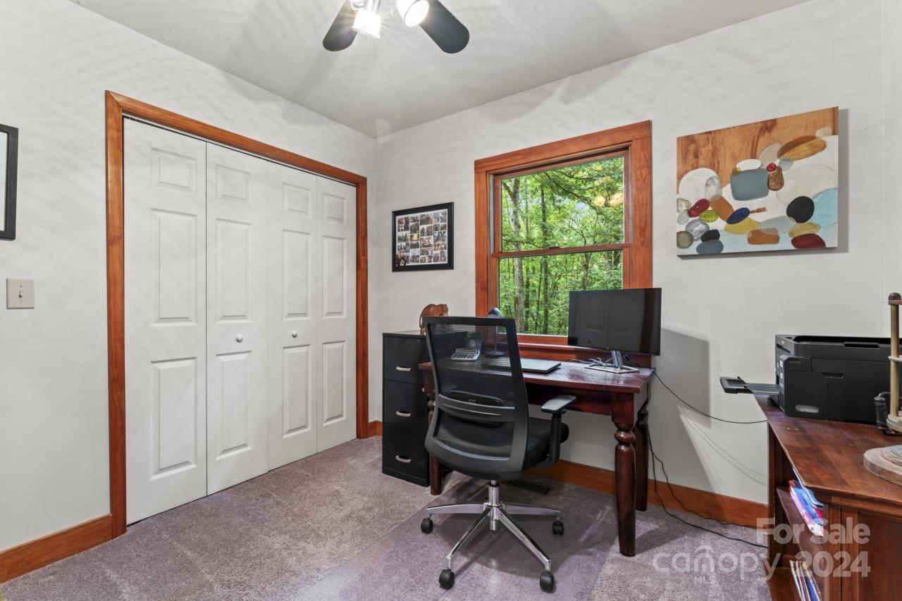 2440 Sloop Road Mount Ulla, NC 28125 - Photo 17 of 48 a view of a workspace with furniture and a window