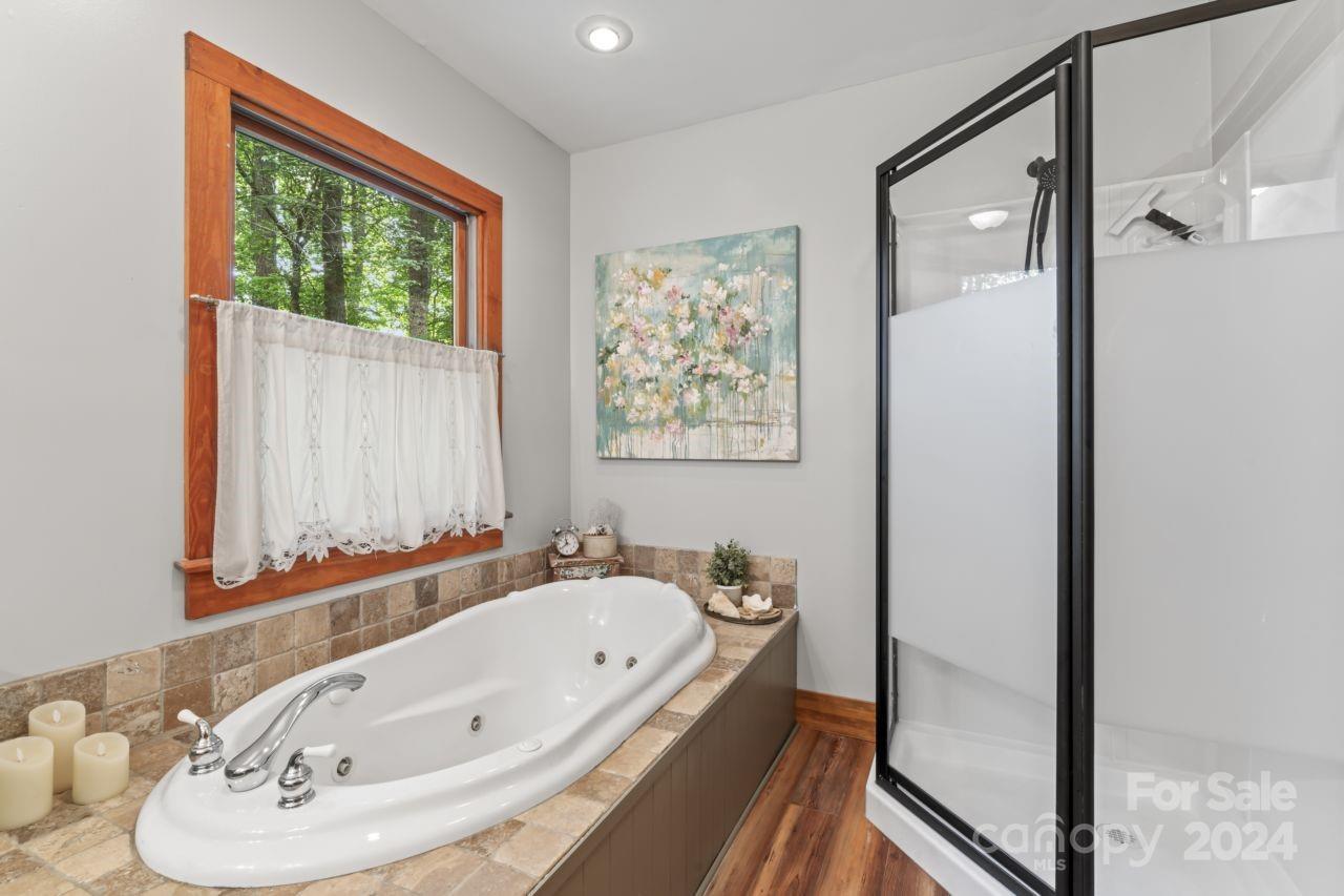 2440 Sloop Road Mount Ulla, NC 28125 - Photo 20 of 48 a bathroom with a tub and a sink
