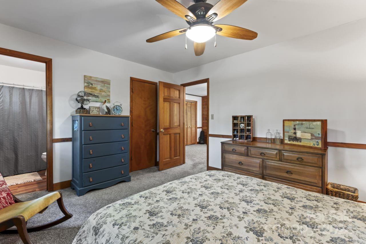 2440 Sloop Road Mount Ulla, NC 28125 - Photo 29 of 48 a bedroom with a bed and furniture