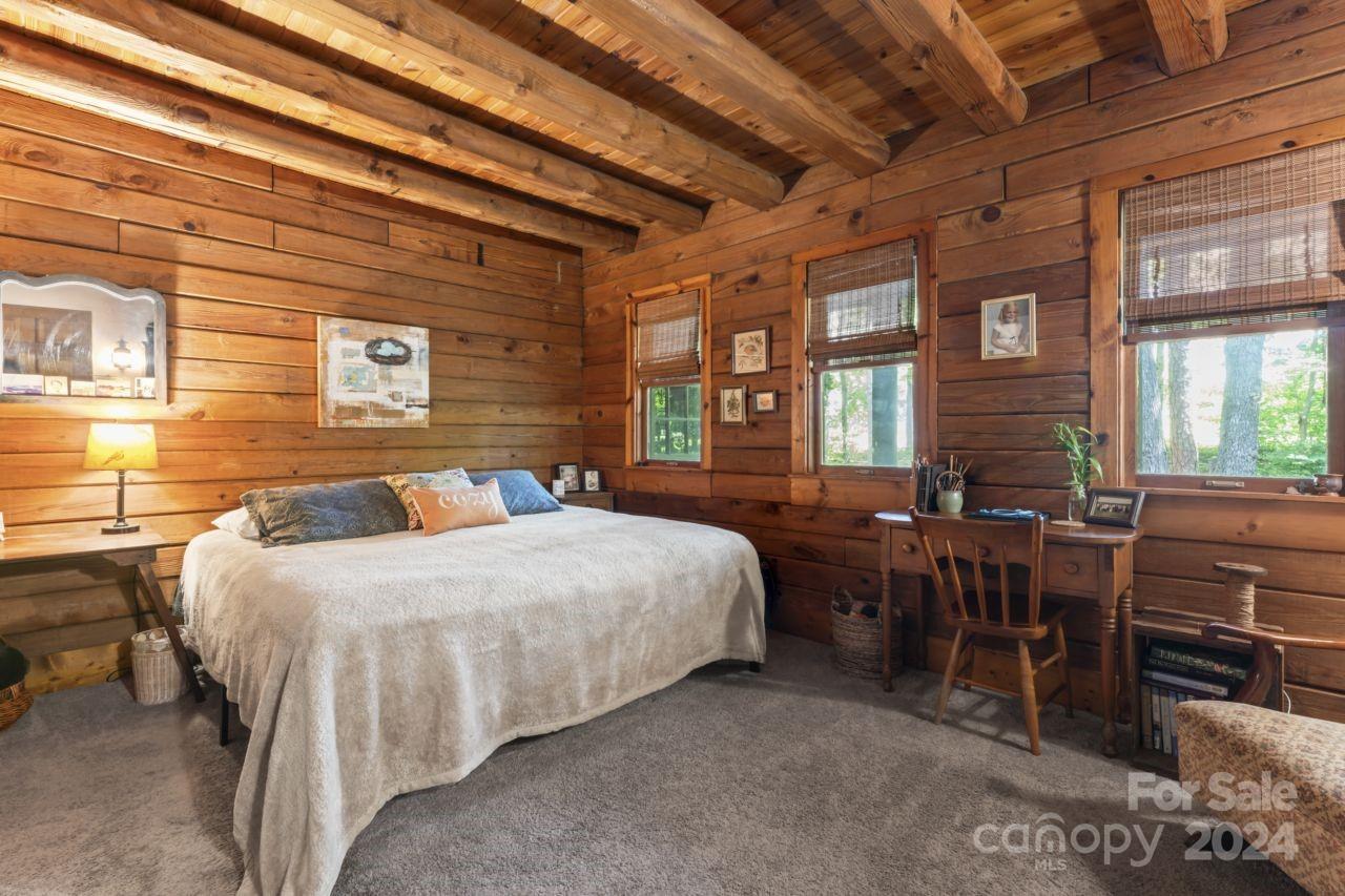 2440 Sloop Road Mount Ulla, NC 28125 - Photo 3 of 48 a bedroom with a bed and wooden floors