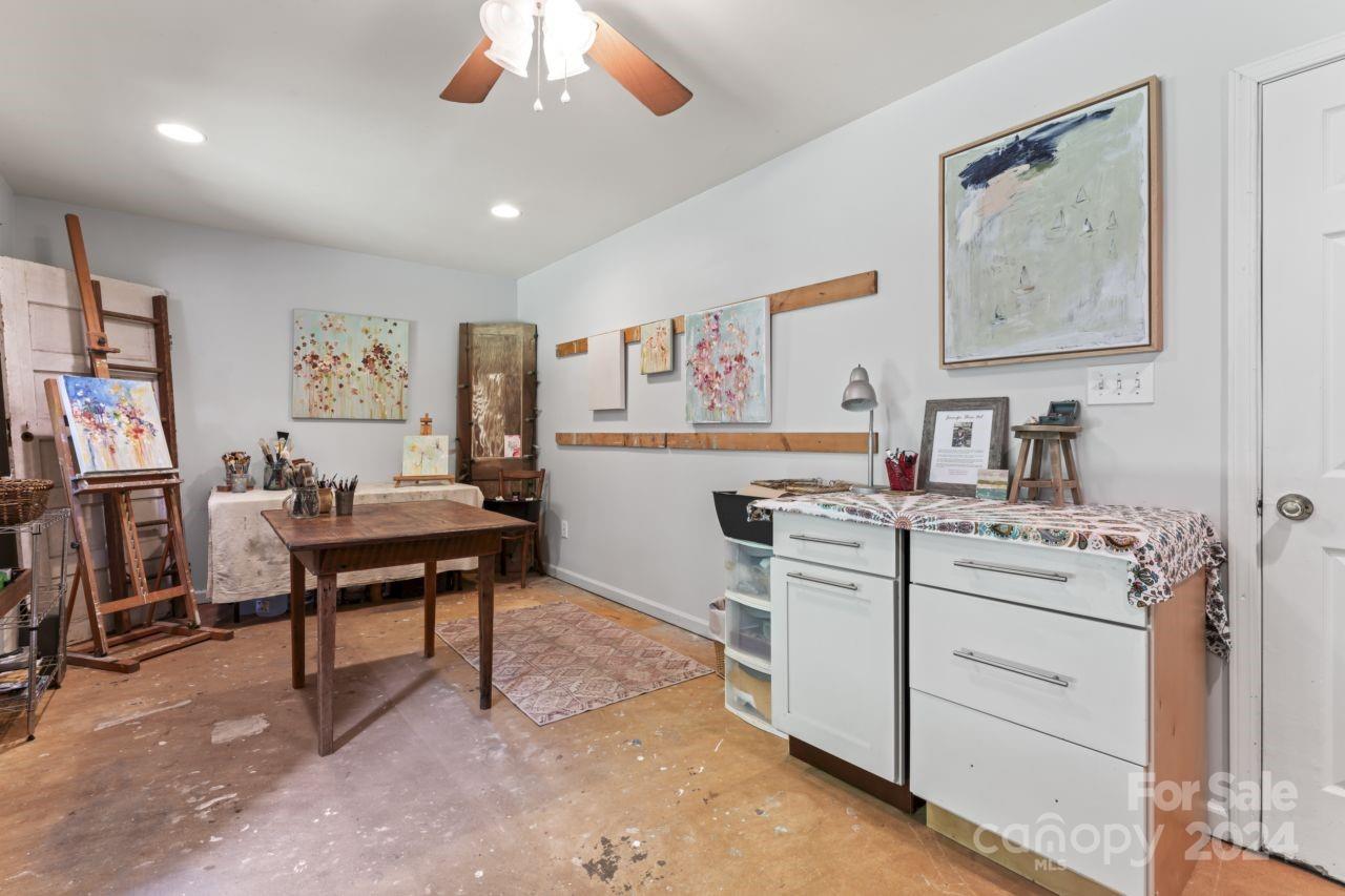 2440 Sloop Road Mount Ulla, NC 28125 - Photo 32 of 48 a view of workspace with furniture and a ceiling fan