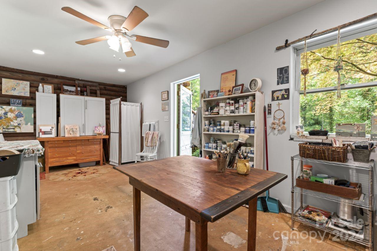 2440 Sloop Road Mount Ulla, NC 28125 - Photo 33 of 48 a view of a dining room with furniture window and outside view