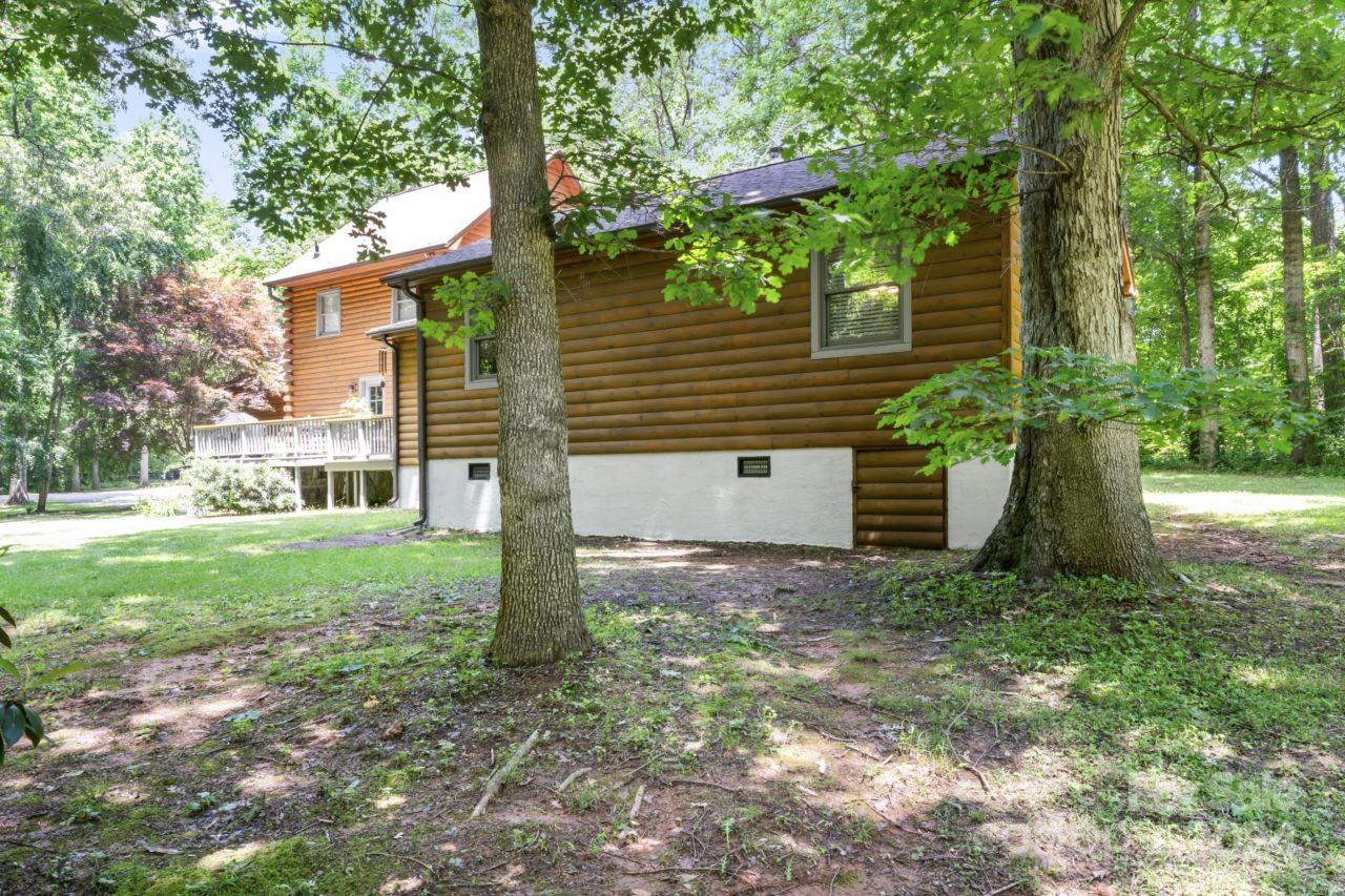 2440 Sloop Road Mount Ulla, NC 28125 - Photo 39 of 48 a view of a house with backyard and a tree