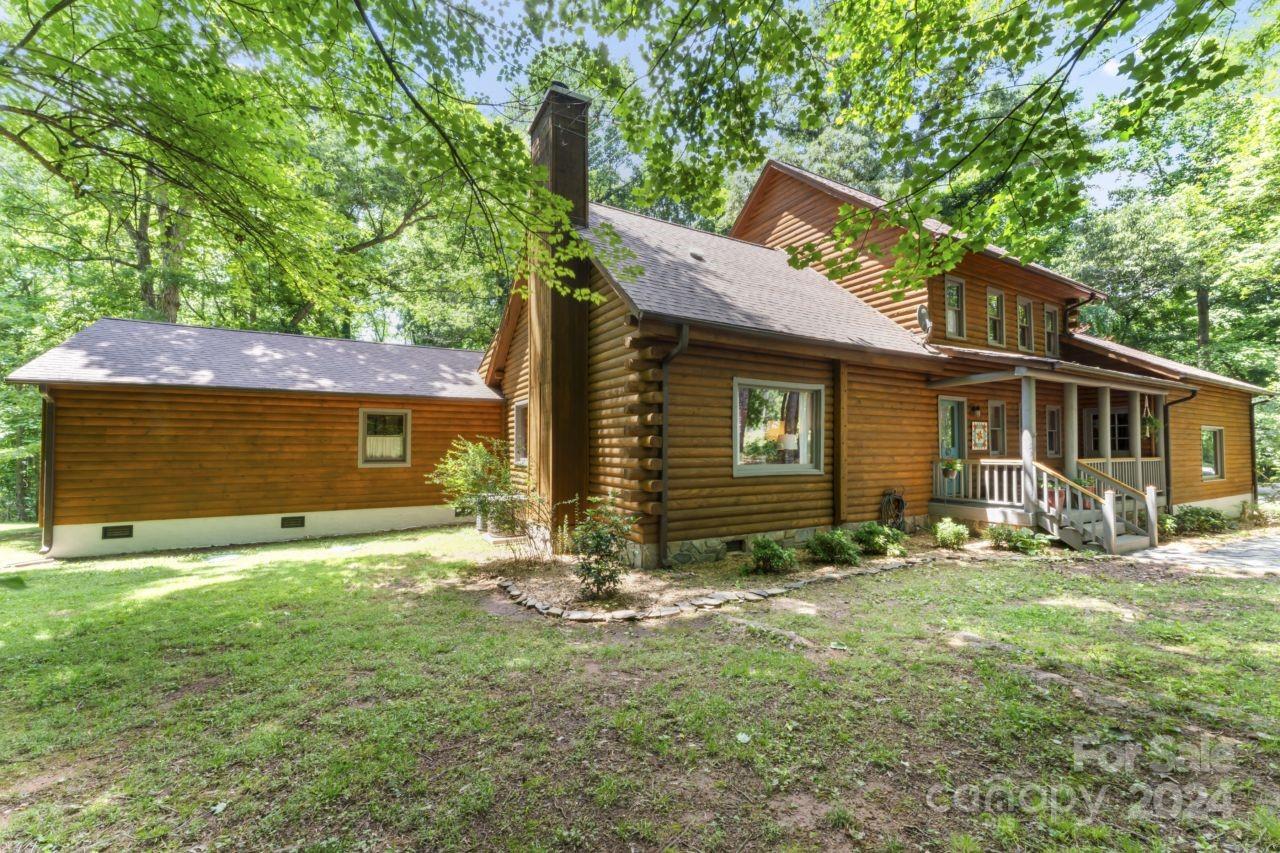 2440 Sloop Road Mount Ulla, NC 28125 - Photo 40 of 48 a view of a house with a yard