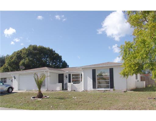 9105 Hermitage Lane Port Richey, FL 34668 - Photo 1 of 1 a house view with a garden space