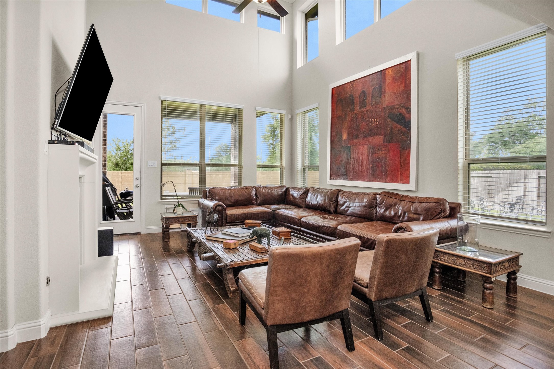 7451 Bethpage Lane Spring, TX 77389 - Photo 12 of 31 a living room with furniture fireplace and flat screen tv