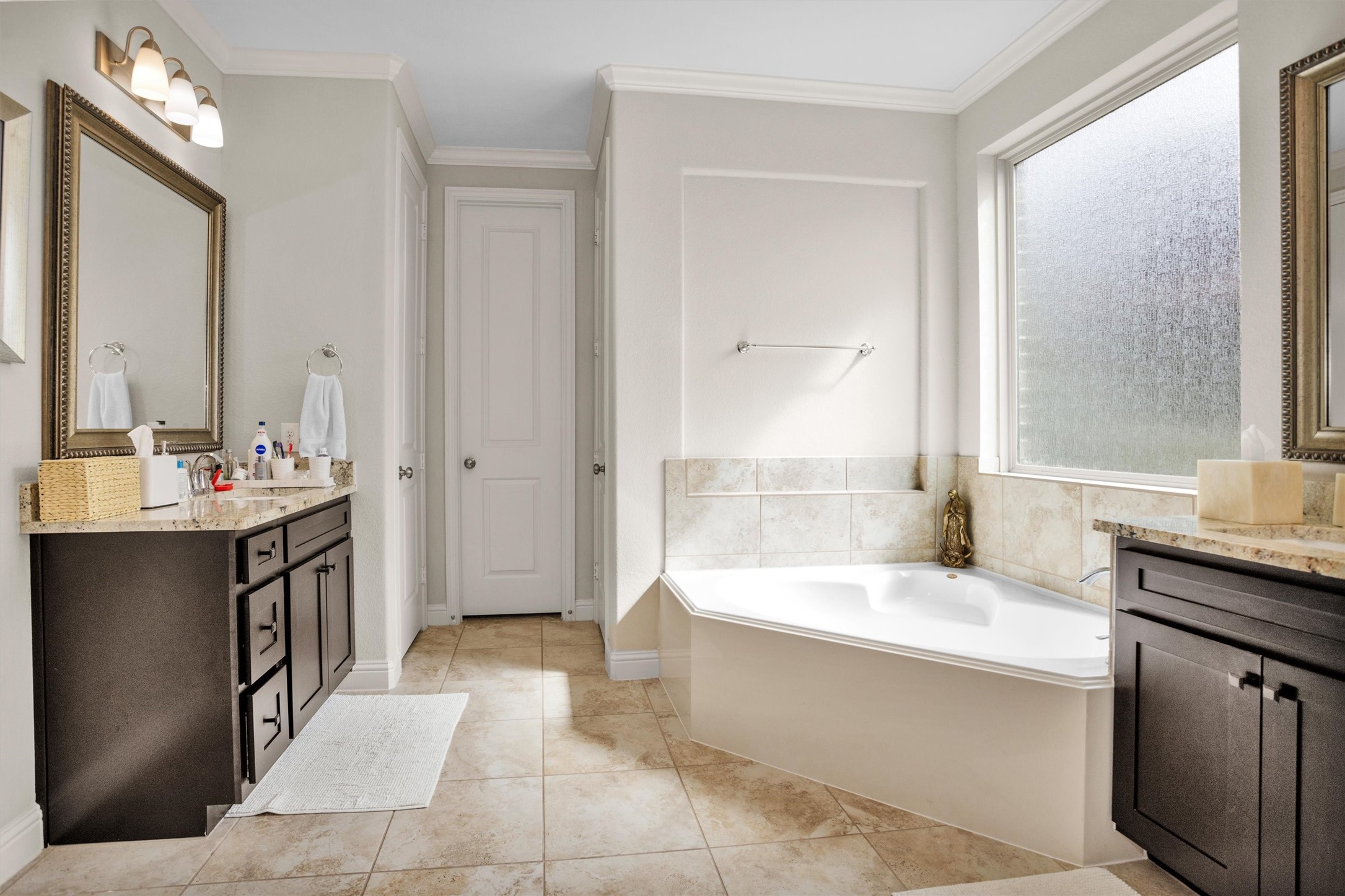 7451 Bethpage Lane Spring, TX 77389 - Photo 17 of 31 a bathroom with a tub sink and mirror